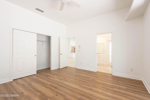 6062 Sabal Crossing Ct, Port Orange, FL 32128 - unfurnished bedroom featuring light wood-type flooring, a closet, ensuite bathroom, and baseboards