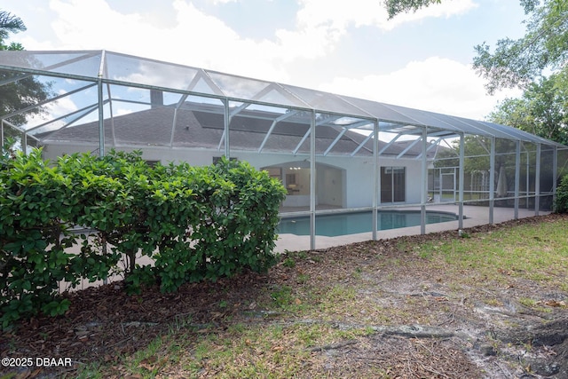 6062 Sabal Crossing Ct, Port Orange, FL 32128 - rear view of house featuring an outdoor pool and a lanai