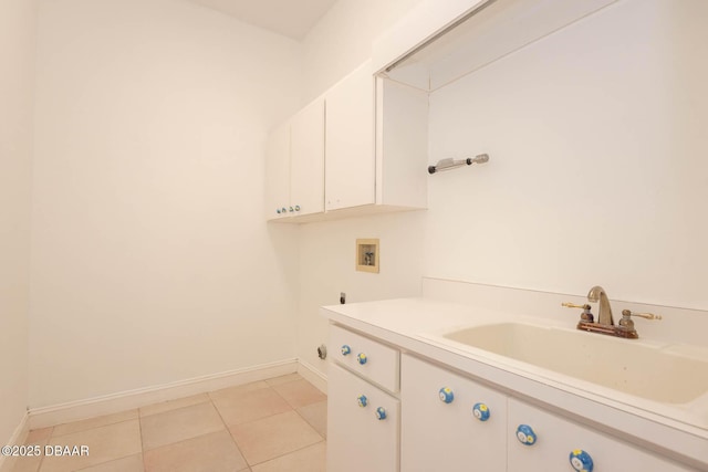 6062 Sabal Crossing Ct, Port Orange, FL 32128 - washroom with hookup for a washing machine, cabinet space, light tile patterned floors, and baseboards