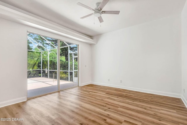 6062 Sabal Crossing Ct, Port Orange, FL 32128 - spare room featuring wood finished floors, a ceiling fan, and baseboards