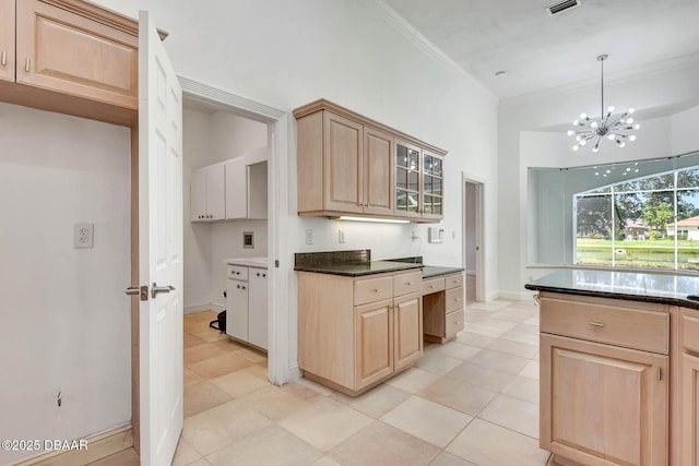6062 Sabal Crossing Ct, Port Orange, FL 32128 - kitchen with light brown cabinets, ornamental molding, light tile patterned flooring, a chandelier, and glass insert cabinets