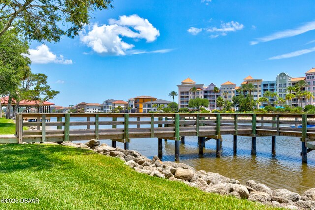 146 Palm Coast Resort Blvd Unit 501, Palm Coast, FL 32137 - dock featuring a water view and a lawn