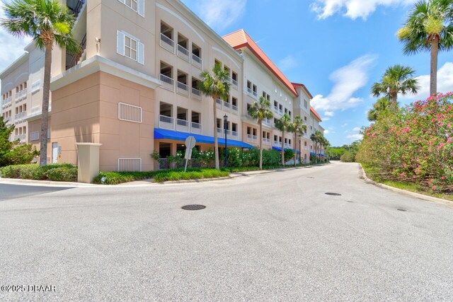 146 Palm Coast Resort Blvd Unit 501, Palm Coast, FL 32137 - view of apartment building / complex