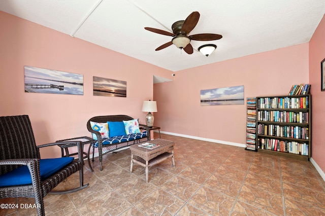 living area featuring ceiling fan