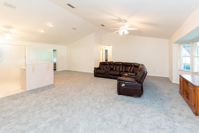 living room featuring light colored carpet, ceiling fan, and lofted ceiling