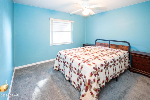 living room with ceiling fan, lofted ceiling, and light carpet