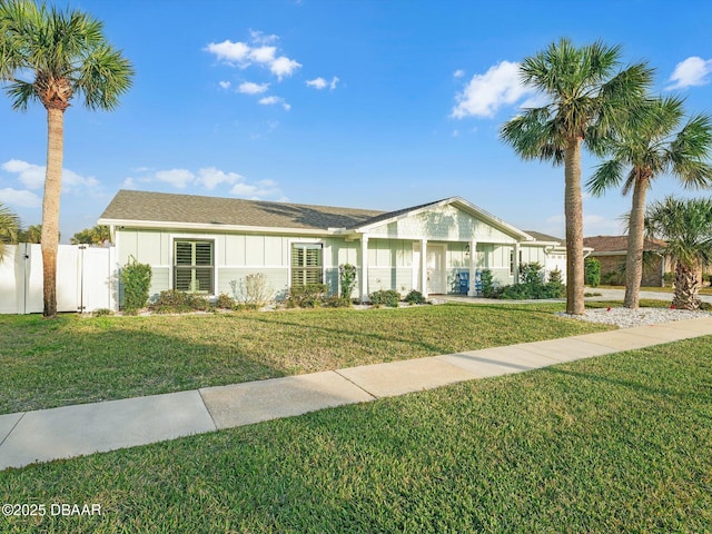 ranch-style home with a front lawn