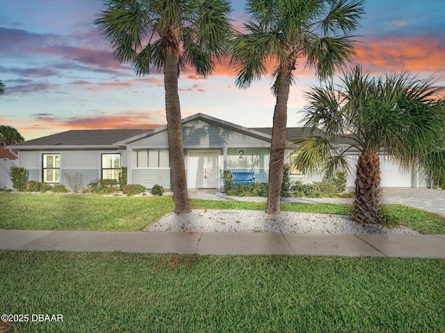 view of front of property with a yard