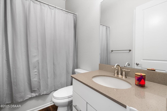 full bathroom featuring vanity, shower / tub combo, and toilet