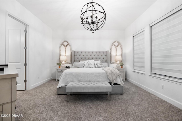 bedroom featuring a notable chandelier and carpet floors