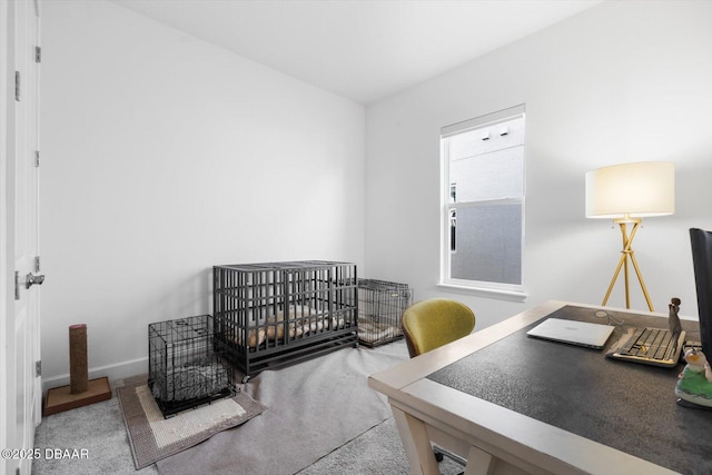 carpeted bedroom with a nursery area