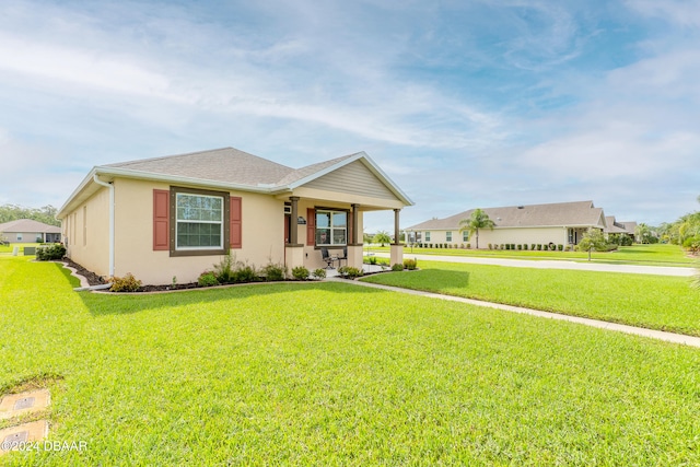 single story home featuring a front yard