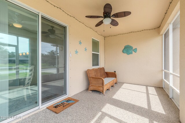 sunroom / solarium with ceiling fan