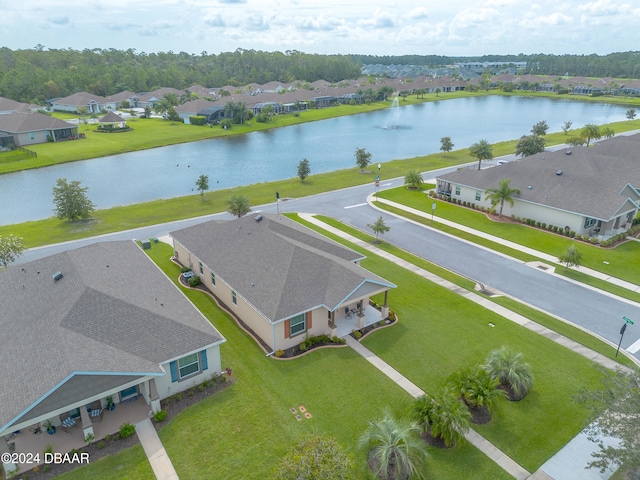 drone / aerial view featuring a residential view and a water view