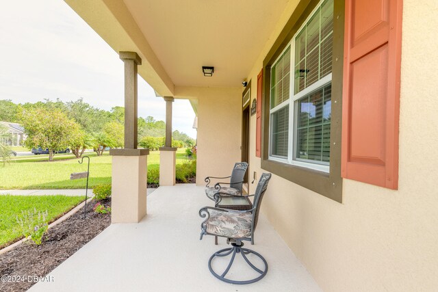 view of patio featuring a porch