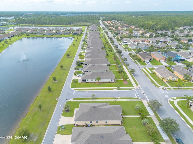 birds eye view of property featuring a water view and a residential view