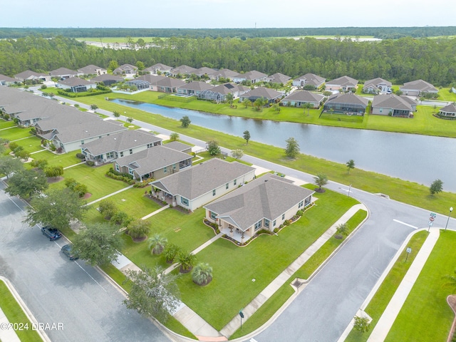 birds eye view of property featuring a water view and a residential view