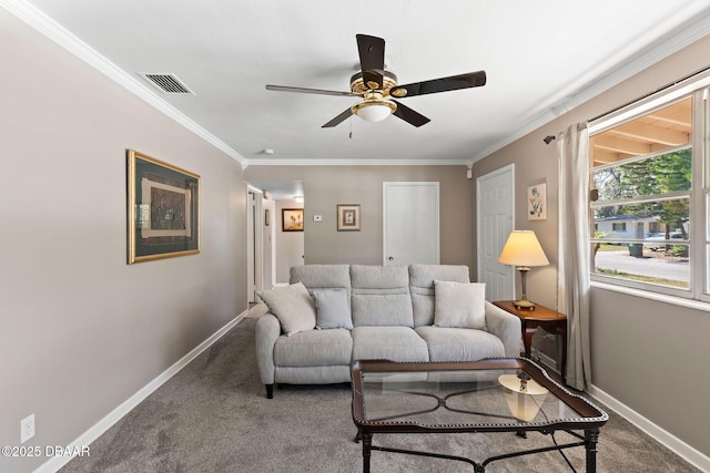 carpeted living room with crown molding and ceiling fan