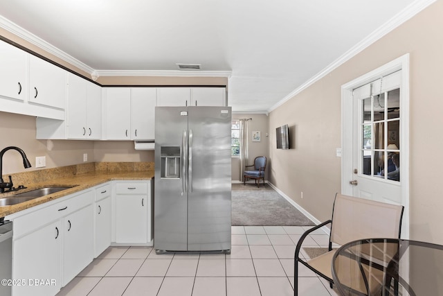 kitchen featuring white cabinetry, stainless steel appliances, and sink