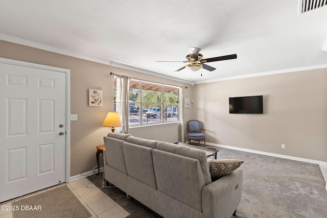 living room with crown molding, ceiling fan, and light tile patterned flooring