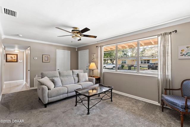 living room with light carpet, ornamental molding, and ceiling fan