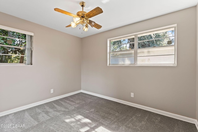 carpeted empty room featuring ceiling fan