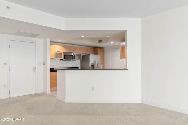 kitchen with dark countertops, visible vents, stainless steel appliances, and recessed lighting