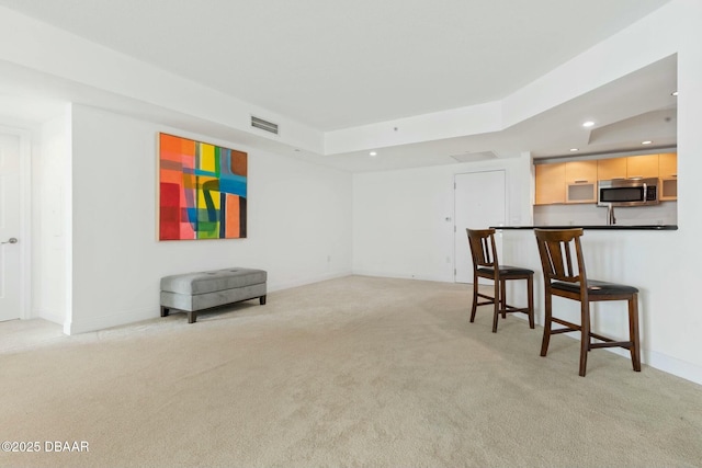 231 Riverside Dr Unit 304-1, Daytona Beach, FL 32117 - interior space with visible vents, baseboards, recessed lighting, a raised ceiling, and light colored carpet