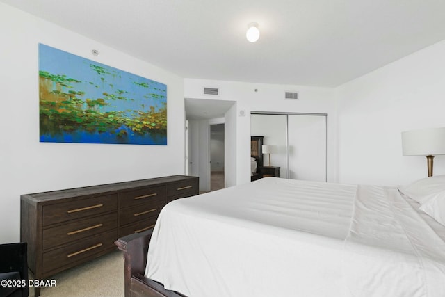 231 Riverside Dr Unit 304-1, Daytona Beach, FL 32117 - bedroom featuring light carpet, visible vents, and a closet
