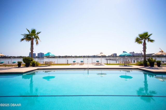 view of pool with a patio area, fence, and a fenced in pool