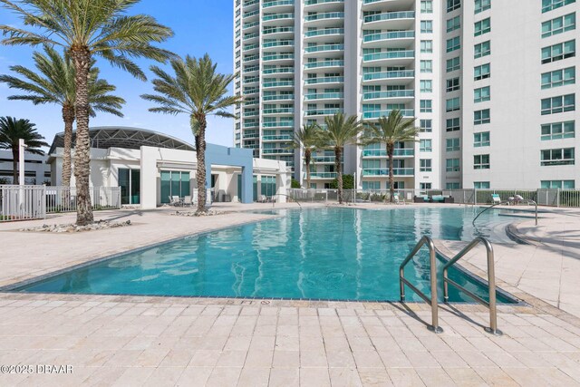 view of pool featuring fence