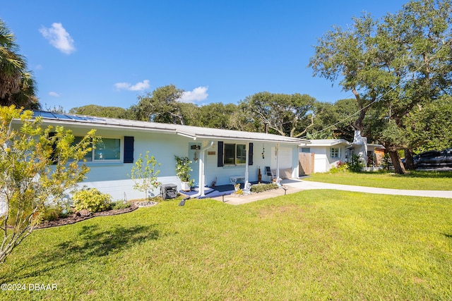 ranch-style home featuring a front yard