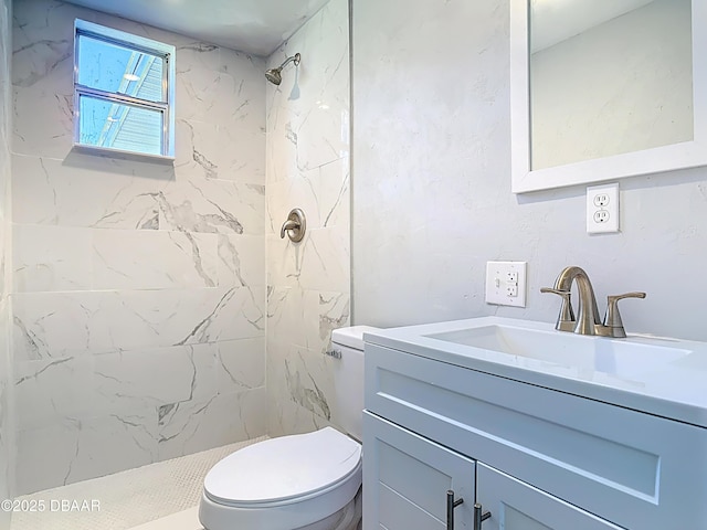 full bath with vanity, toilet, and a stall shower