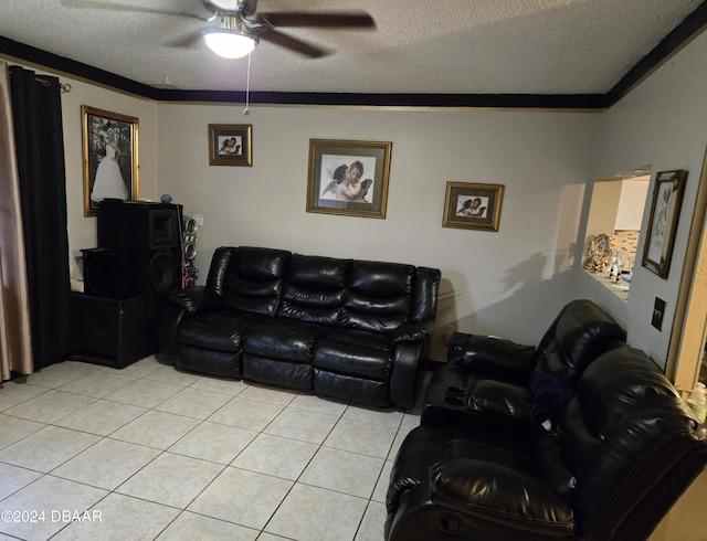 tiled living room with ceiling fan, ornamental molding, and a textured ceiling