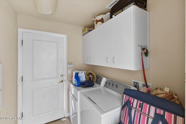 684 Aldenham Ln, Ormond Beach, FL 32174 - washroom with washer and clothes dryer, cabinet space, and light tile patterned floors