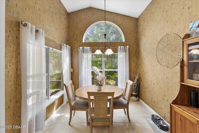 684 Aldenham Ln, Ormond Beach, FL 32174 - dining area featuring light tile patterned floors and high vaulted ceiling