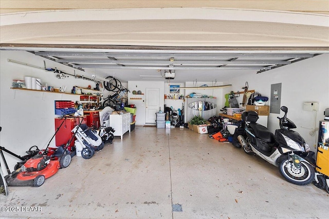 684 Aldenham Ln, Ormond Beach, FL 32174 - garage with electric panel, a workshop area, and a garage door opener