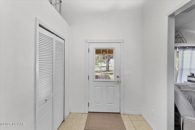 684 Aldenham Ln, Ormond Beach, FL 32174 - entryway featuring light tile patterned flooring and baseboards
