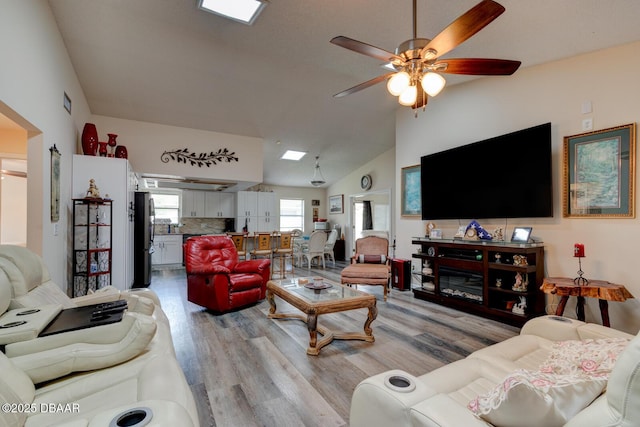 144 Herring Gull Ct, Daytona Beach, FL 32119 - living area featuring light wood finished floors, a ceiling fan, and high vaulted ceiling