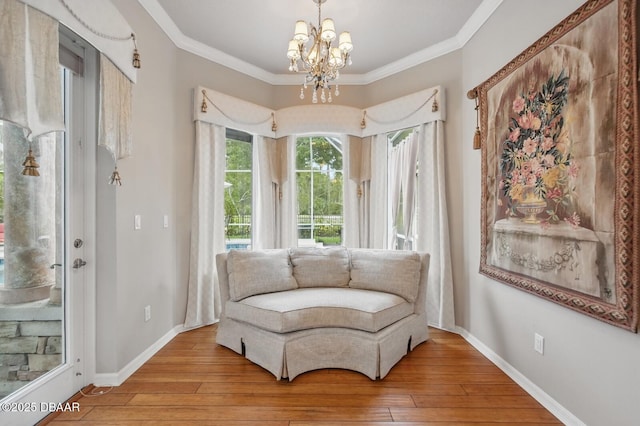 109 Edward Dr, Palm Coast, FL 32164 - living area featuring a chandelier, hardwood / wood-style floors, and ornamental molding