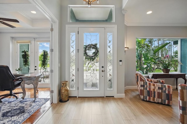 109 Edward Dr, Palm Coast, FL 32164 - entrance foyer featuring crown molding, ceiling fan, wood finished floors, recessed lighting, and beam ceiling