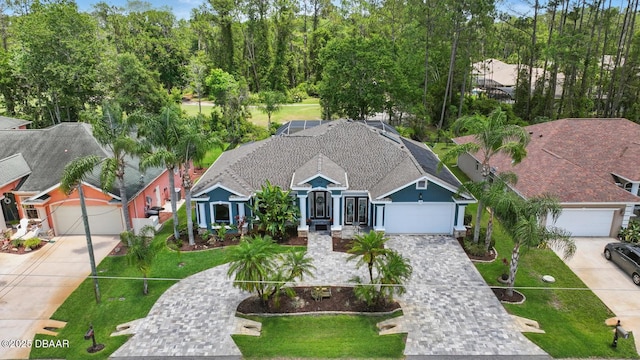 109 Edward Dr, Palm Coast, FL 32164 - single story home with decorative driveway, a garage, and a front yard