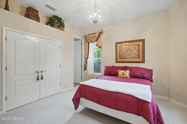 109 Edward Dr, Palm Coast, FL 32164 - carpeted bedroom featuring a chandelier and a closet