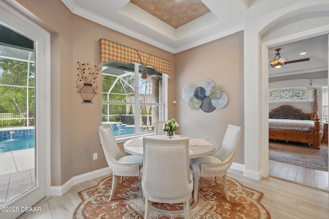 109 Edward Dr, Palm Coast, FL 32164 - dining area featuring healthy amount of natural light, wood finished floors, a ceiling fan, and ornamental molding
