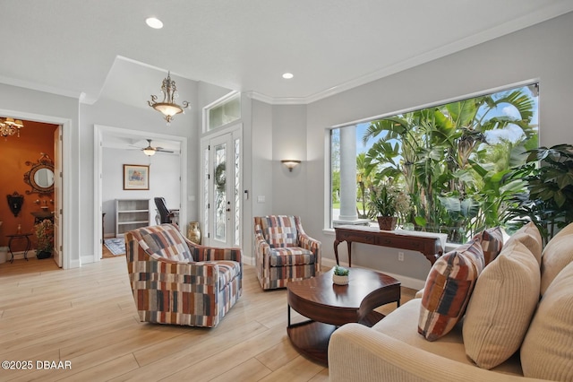 109 Edward Dr, Palm Coast, FL 32164 - living room featuring light wood-type flooring, recessed lighting, ornamental molding, and a ceiling fan