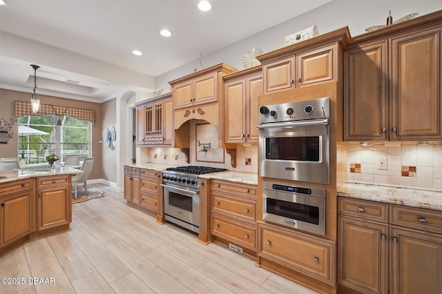 109 Edward Dr, Palm Coast, FL 32164 - kitchen featuring stainless steel appliances, recessed lighting, light stone countertops, pendant lighting, and tasteful backsplash