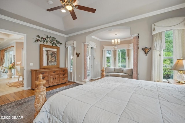 109 Edward Dr, Palm Coast, FL 32164 - bedroom featuring wood finished floors, multiple windows, a chandelier, ornamental molding, and access to exterior
