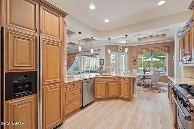 109 Edward Dr, Palm Coast, FL 32164 - kitchen with appliances with stainless steel finishes, light stone countertops, recessed lighting, light wood-style floors, and a peninsula