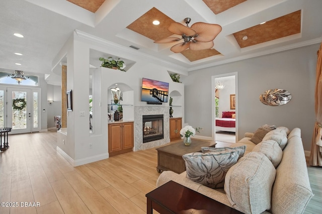 109 Edward Dr, Palm Coast, FL 32164 - living area featuring coffered ceiling, a ceiling fan, light wood-style flooring, recessed lighting, and a tiled fireplace