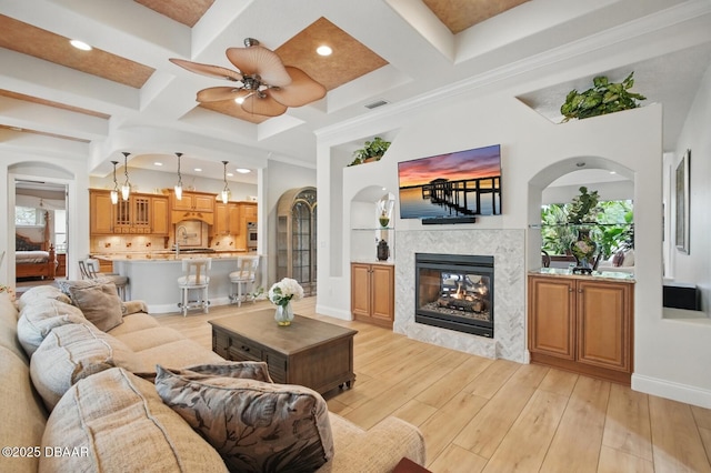 109 Edward Dr, Palm Coast, FL 32164 - living room with coffered ceiling, ceiling fan, a multi sided fireplace, light wood-type flooring, and recessed lighting